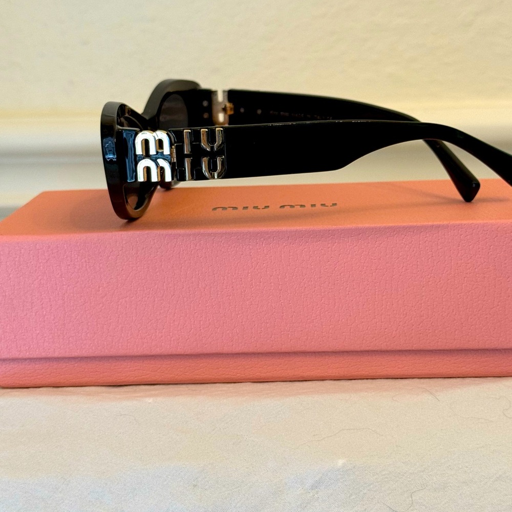 Miu Miu Black Oval Sunglasses